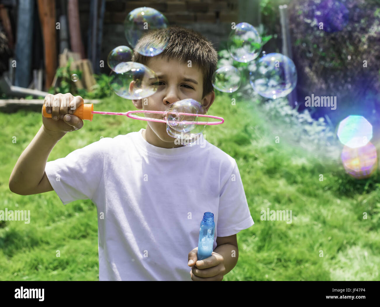 Child makes bubbles Stock Photo Alamy