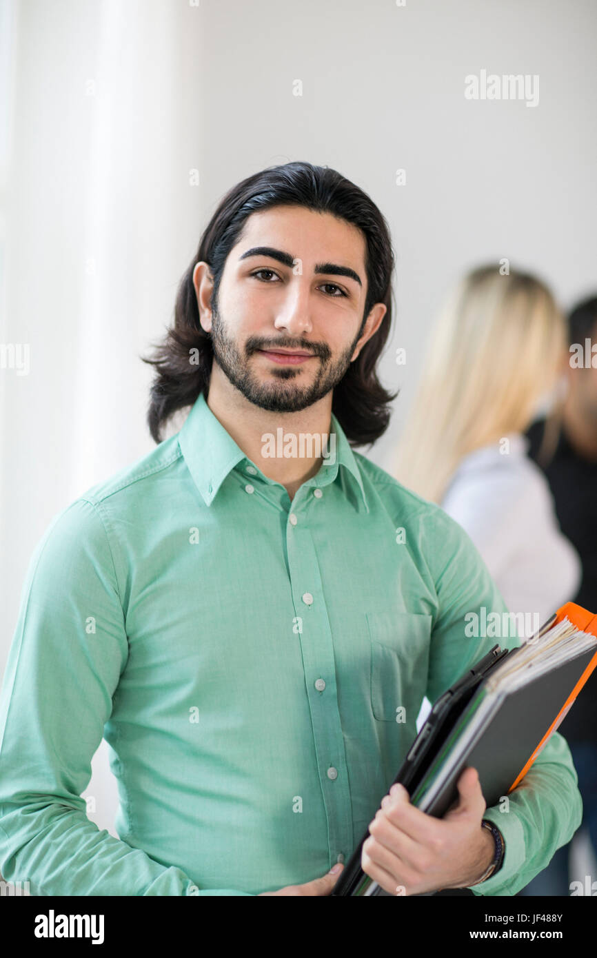 Young man looking at camera Stock Photo - Alamy