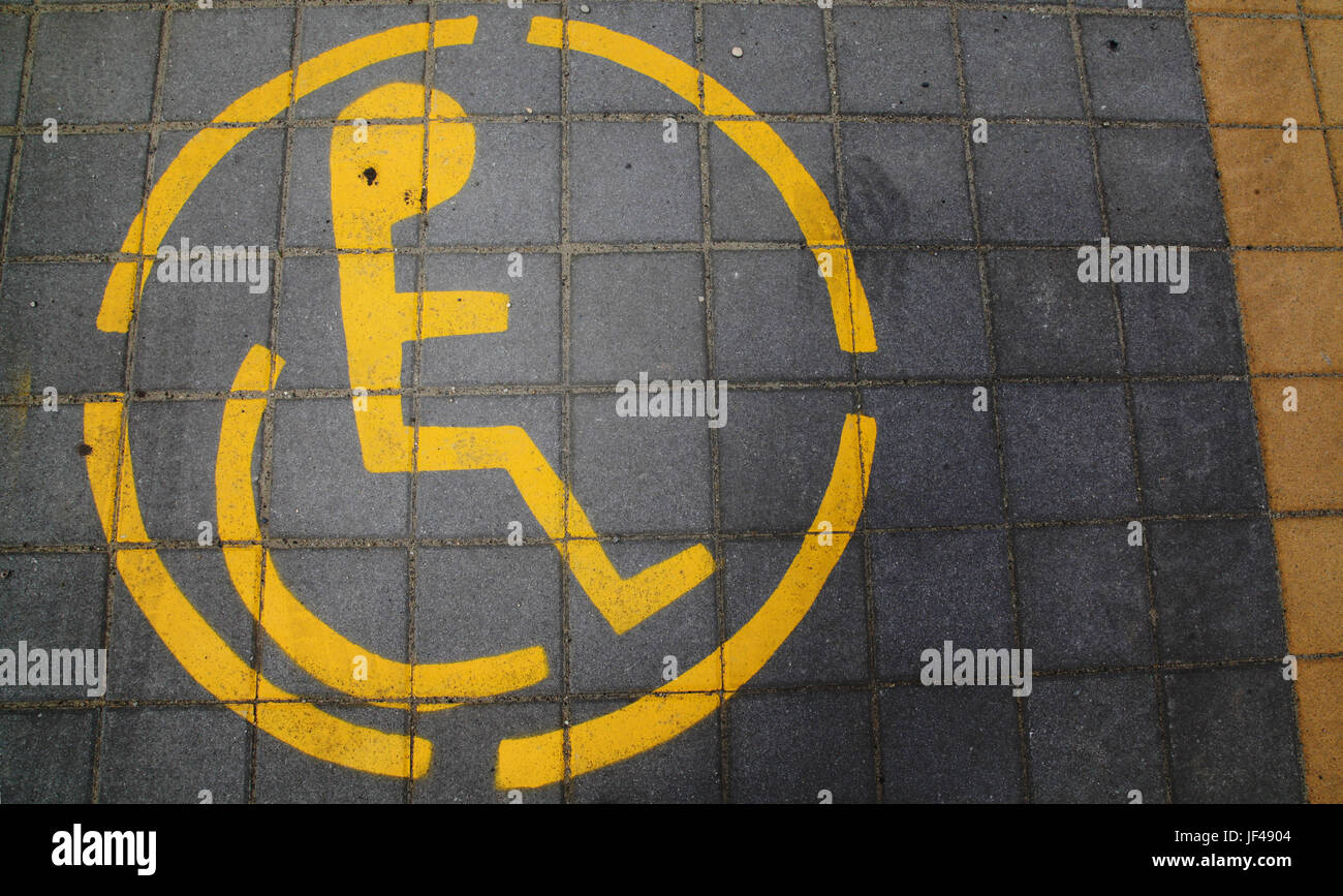 Sign for parking for handicapped or disabled persons placed on concrete pavement Stock Photo