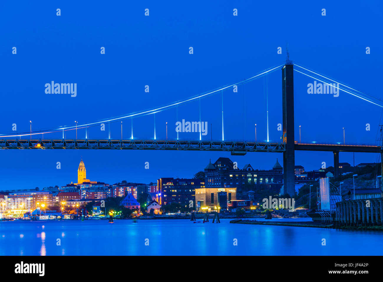 City and suspension bridge at night Stock Photo - Alamy