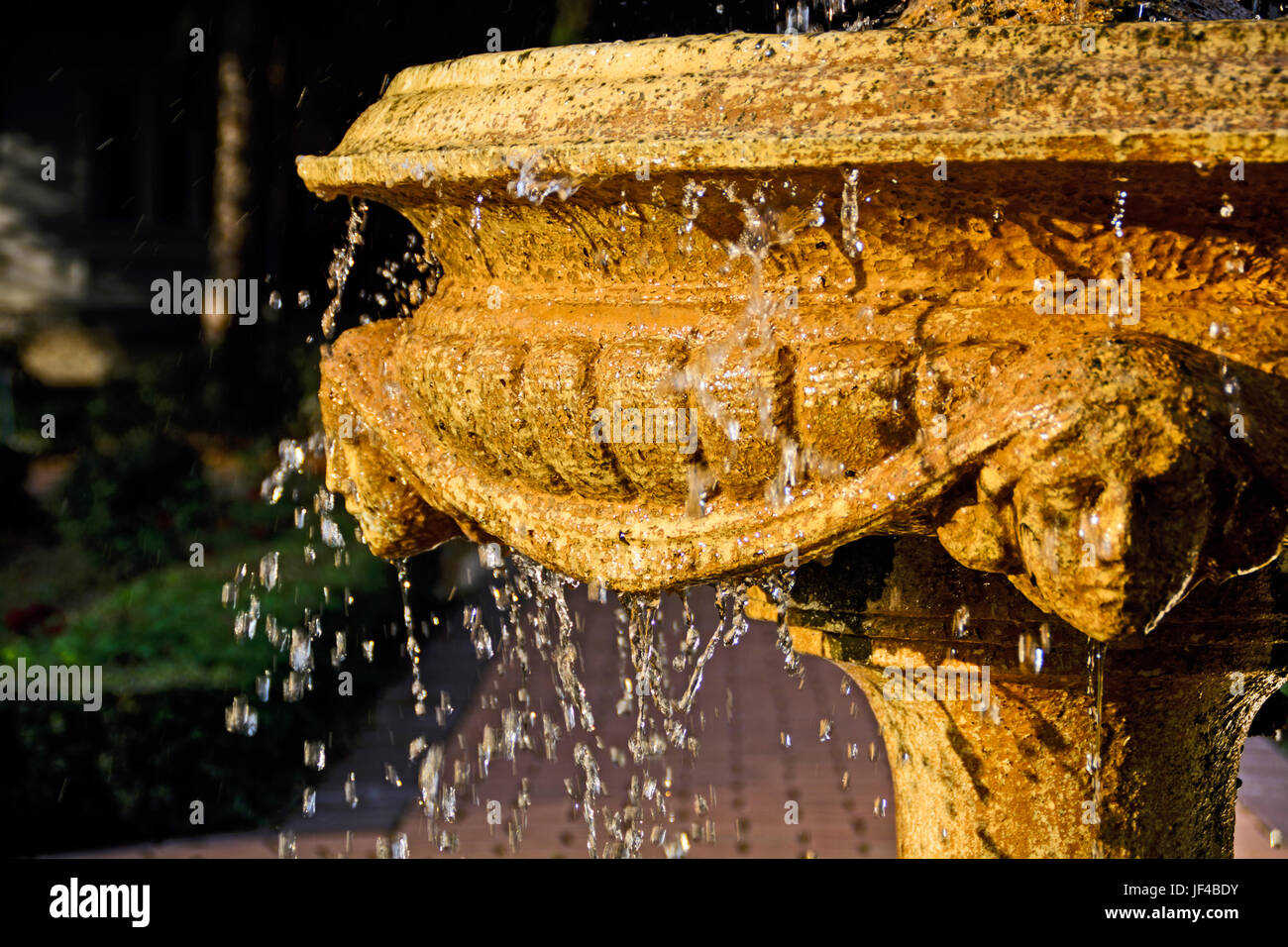 Part of the fountain in the park through which water is leaking Stock