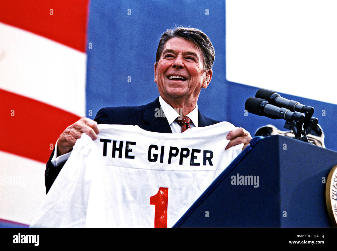 President Reagan holding 'The Gipper' jersey at a Campaign rally in Endicott, New York. 9/12/84. Stock Photo