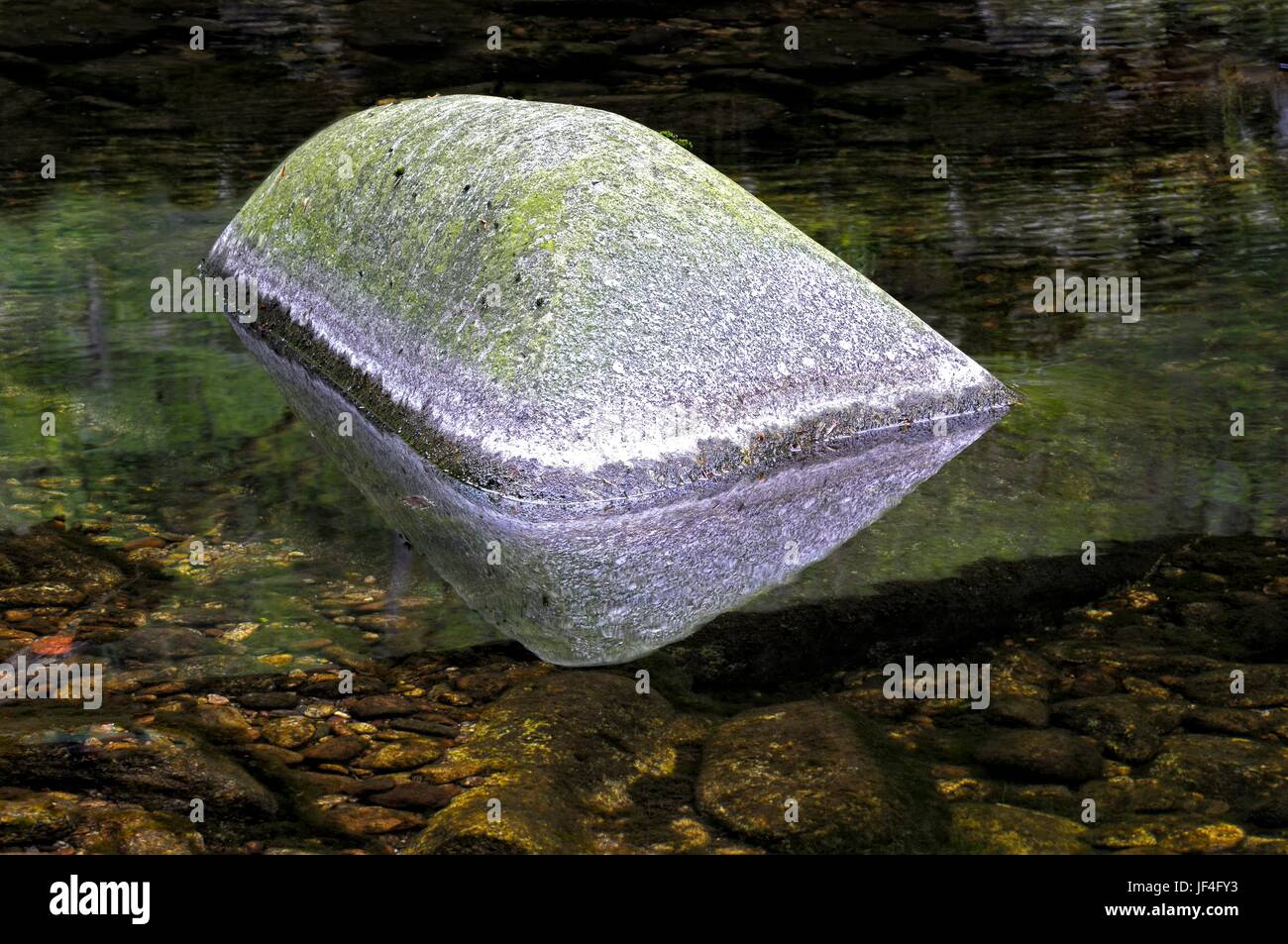 The floating stone in the water Stock Photo Alamy