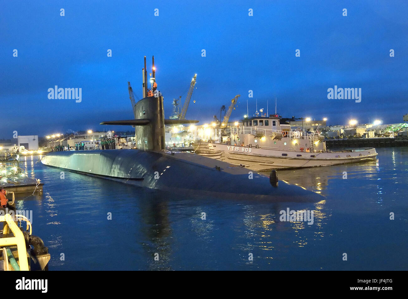 The guided missile submarine USS Ohio SSGN 726 is gently pushed to