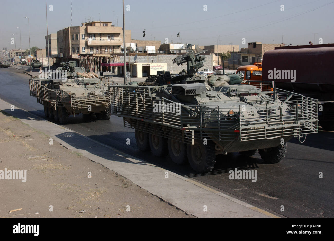 041004-A-0392G-016 U.S. Army soldiers patrol in Stryker armored wheeled vehicles during a search for criminals and weapons as part of Operation Block Party in Mosul, Iraq, on Oct. 4, 2004.  The soldiers are with the 1st Battalion, 14th Cavalry Regiment, 3rd Brigade, Stryker Brigade Combat Team, 2nd Infantry Division, from Fort Lewis, Wash.  DoD photo by Spc. John S. Gurtler, U.S. Army.  (Released) Stock Photo