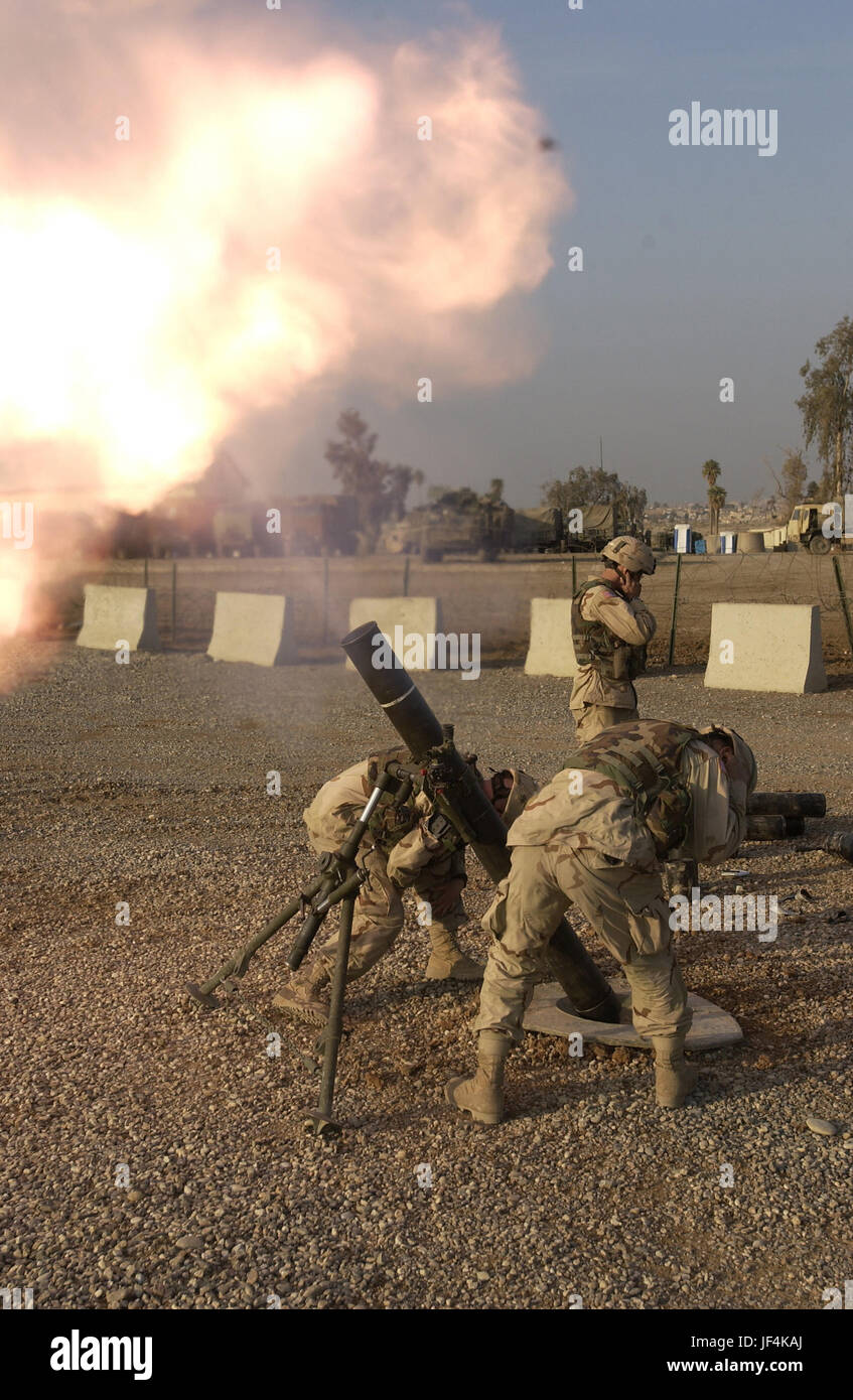 041214-A-3978J-033 U.S. Army soldiers fire 120mm mortars to calibrate the systems at Forward Operation Base Marez in Mosul, Iraq, on Dec. 14, 2004.  The soldiers are assigned to 1st Battalion, 24th Infantry Regiment, 1st Brigade, 25th Infantry Division Stryker Brigade Combat Team.  DoD photo by Sgt. Jeremiah Johnson, U.S. Army.  (Released) Stock Photo