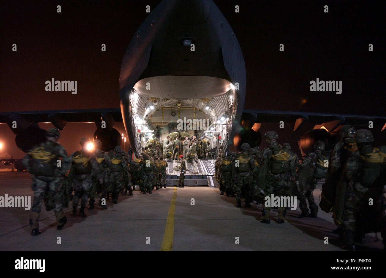 060124-F-0929W-177  Paratroopers from the U.S. Army's 82nd Airborne Division line up to board a U.S. Air Force C-17 Globemaster III aircraft for a night parachute jump during joint forcible entry exercise at Pope Air Force Base, N.C., on Jan. 24, 2006.  The 82nd is from nearby Fort Bragg, N.C.  DoD photo by Tech. Sgt Sean M. Worrell, U.S. Air Force.  (Released) Stock Photo