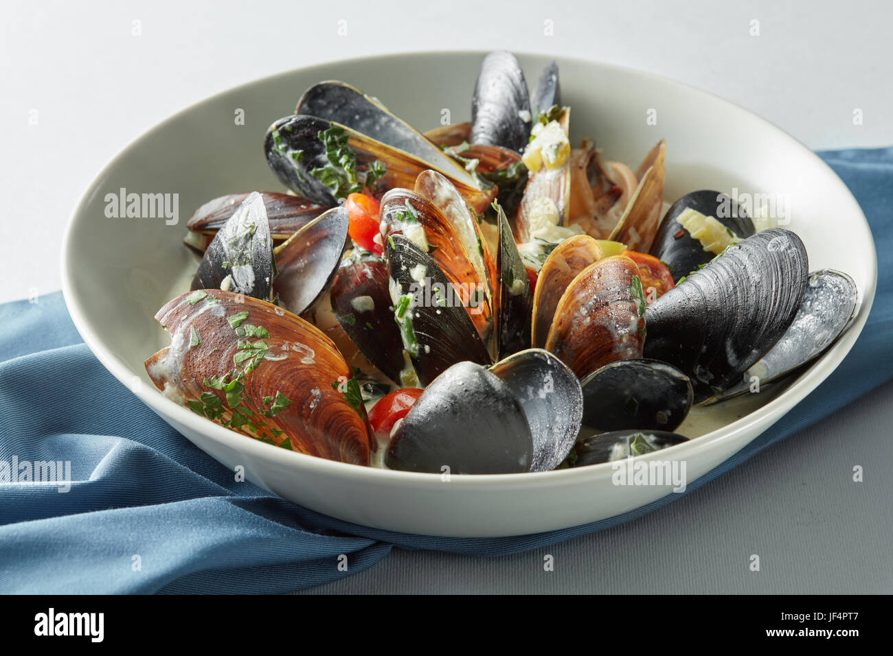 dish of mussels pics with tomato sauce Stock Photo