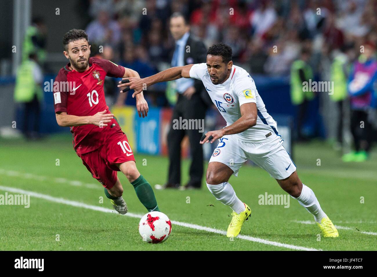 Kazan, Russia. 28th June, 2017. Jean Beausejour (R) of Chile vies for the ball with Bernardo Silva of Portugal during the FIFA Confederations Cup 2017 semifinal match in Kazan, Russia, June 28, 2017. Credit: Evgeny Sinitsyn/Xinhua/Alamy Live News Stock Photo