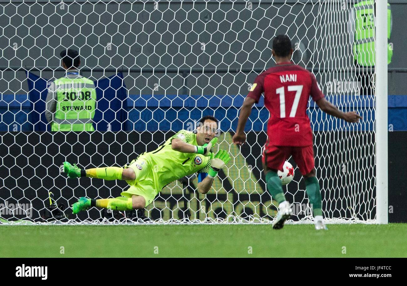 Kazan, Russia. 28th June, 2017. Goalkeeper Claudio Bravo (bottom) of Chile dives to save the penalty shot from Nani of Portugal during the FIFA Confederations Cup 2017 semifinal match in Kazan, Russia, June 28, 2017. Credit: Bai Xueqi/Xinhua/Alamy Live News Stock Photo