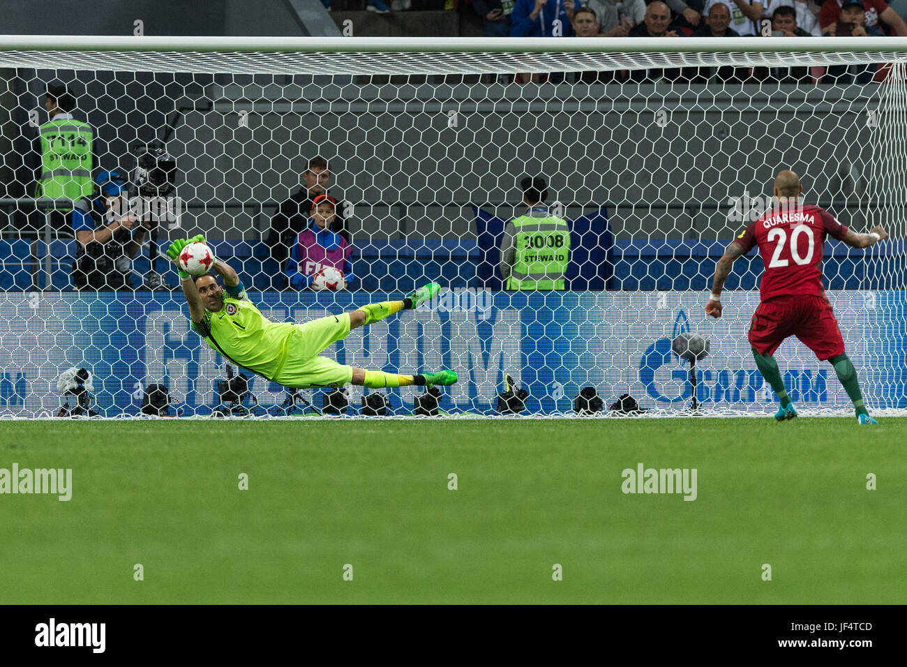 Kazan, Russia. 28th June, 2017. Goalkeeper Claudio Bravo (L) of Chile dives to save the penalty shot from Ricardo Quaresma of Portugal during the FIFA Confederations Cup 2017 semifinal match in Kazan, Russia, June 28, 2017. Credit: Bai Xueqi/Xinhua/Alamy Live News Stock Photo