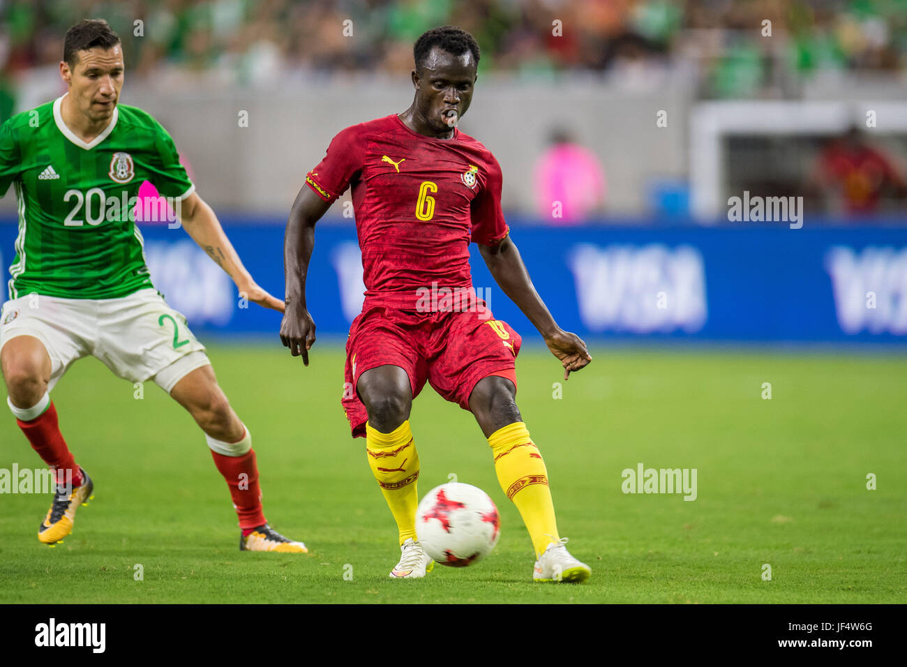 Houston, TX, USA. 28th June, 2017. Ghana midfielder Mohammed Abu (6) controls the ball in front of Mexico midfielder Jesus Duenas (20) during the 2nd half of an international soccer friendly match between Mexico and Ghana at NRG Stadium in Houston, TX. Mexico won the game 1-0.Trask Smith/CSM/Alamy Live News Stock Photo