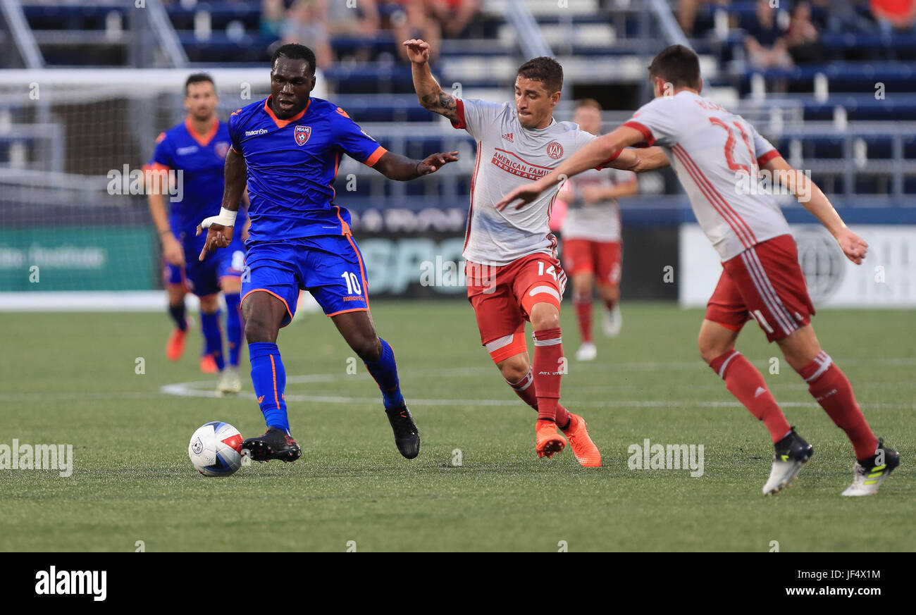 Miami, Florida, USA. 28th June, 2017. Miami FC midfielder Kwadwo Poku (10) drives the ball challenged by Atlanta United FC midfielder Carlos Carmona (14), and Atlanta United FC defender Mark Bloom (21), during the first half of a Lamar Hunt US Open Cup, Round of 16 game, between the Atlanta United FC vs Miami FC at the Riccardo Silva Stadium in Miami, Florida. Mario Houben/CSM/Alamy Live News Stock Photo