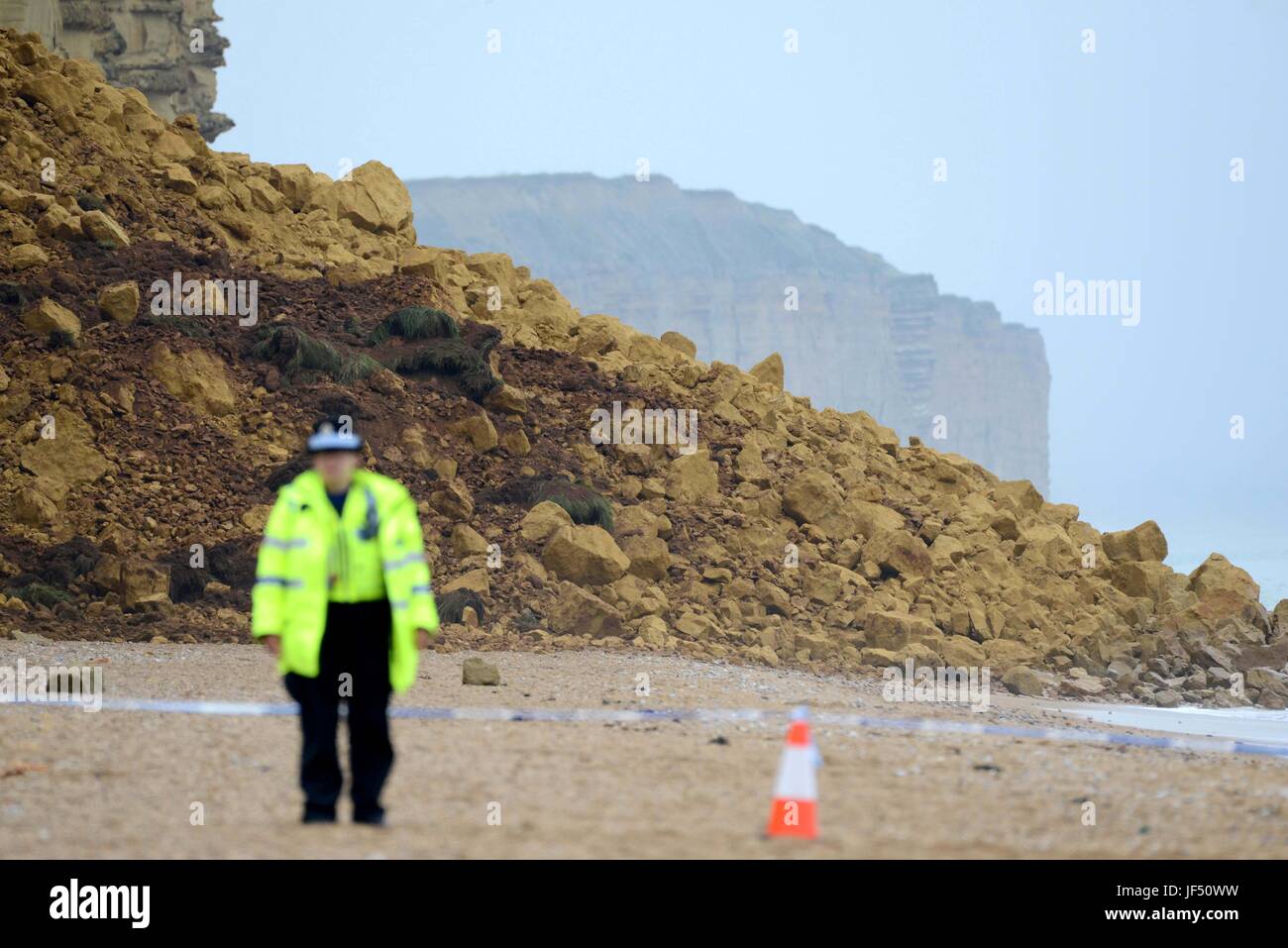 West Bay, Dorset, UK. 29th June, 2017. Police close East Beach and cliff path after a massive cliff fall at West Bay, Dorset, UK Credit: Finnbarr Webster/Alamy Live News Stock Photo