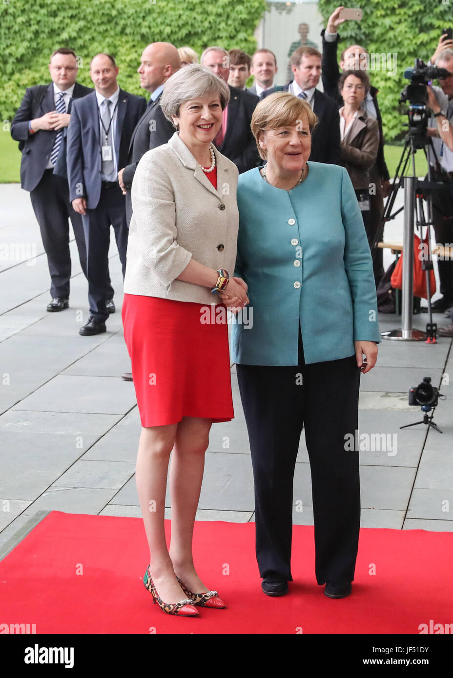 Berlin, Germany. 29th June, 2017. German Chancellor Angela Merkel (R) poses for photos with British Prime Minister Theresa May (L) before the preparation meeting for G20 at German Chancellery in Berlin, capital of Germany, on June 29, 2017. Credit: Shan Yuqi/Xinhua/Alamy Live News Stock Photo