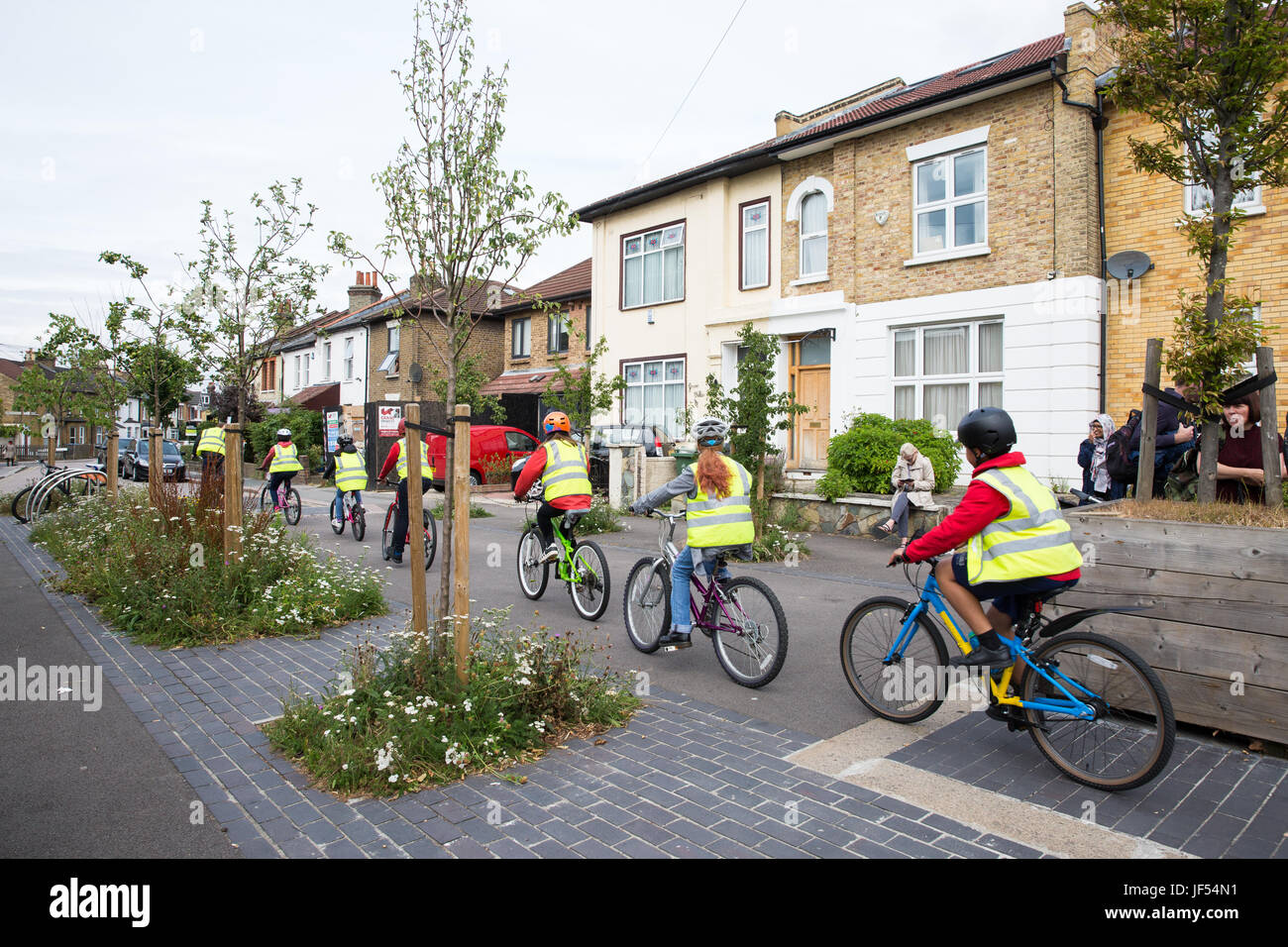 London, UK. 29th June, 2017. Cyclists pass through a closure in Grove Road installed in conjunction with the London Borough of Waltham Forest's Mini-Holland scheme and Enjoy Waltham Forest programme. Credit: Mark Kerrison/Alamy Live News Stock Photo
