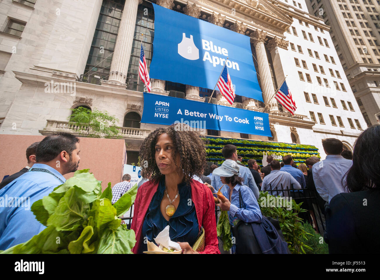 New York, USA. 29th June, 2017. Broad Street in front of the New York Stock Exchange is agog with activity during the ceremony for the initial public offering of Blue Apron Holdings, a meal-kit delivery service, on Thursday, June 29, 2017. Blue Apron Holdings Inc. reduced the price of its initial public offering because of the possible impact of the Amazon-Whole Foods Market acquisition. Blue Apron is one of several meal-kit delivery services but the first to have an IPO. ( © Richard B. Levine) Credit: Richard Levine/Alamy Live News Stock Photo