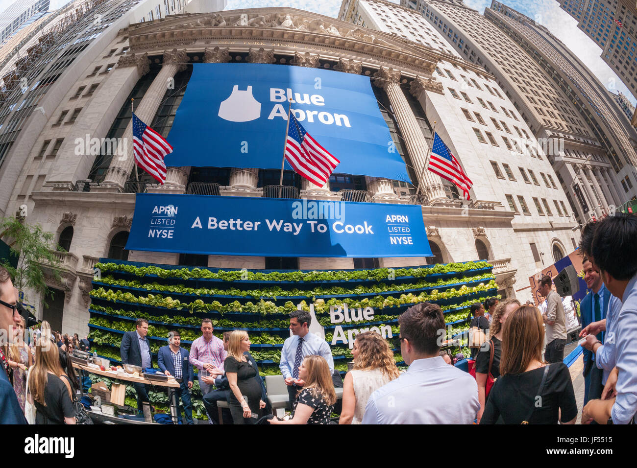 New York, USA. 29th June, 2017. Broad Street in front of the New York Stock Exchange is agog with activity during the ceremony for the initial public offering of Blue Apron Holdings, a meal-kit delivery service, on Thursday, June 29, 2017. Blue Apron Holdings Inc. reduced the price of its initial public offering because of the possible impact of the Amazon-Whole Foods Market acquisition. Blue Apron is one of several meal-kit delivery services but the first to have an IPO. ( © Richard B. Levine) Credit: Richard Levine/Alamy Live News Stock Photo