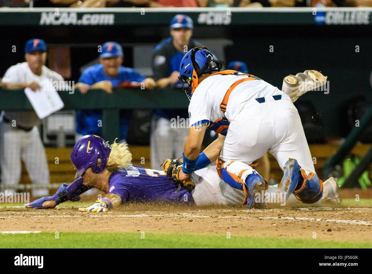 LSU's Greg Deichmann (7) is tagged out by Arkansas short stop Jax