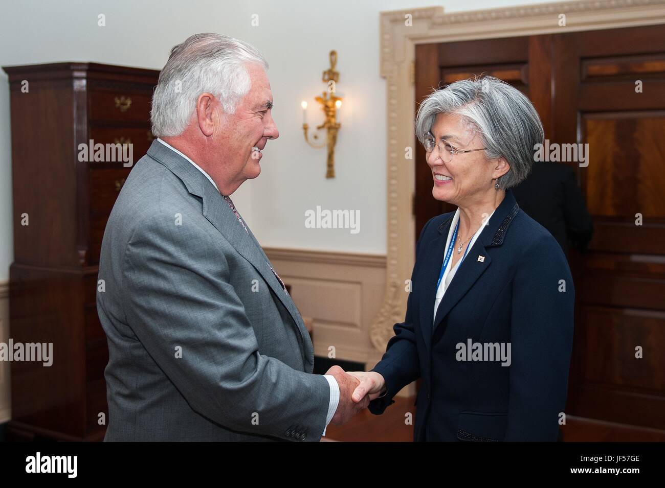 U.S. Secretary of State Rex Tillerson welcomes Korean Foreign Minister Kang Kyung-wha before the start of a bilateral meeting June 28, 2017 in Washington D.C. Stock Photo