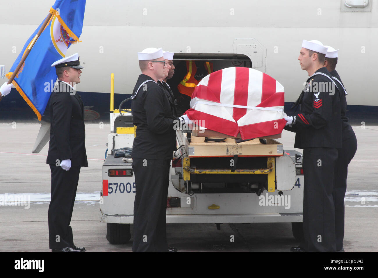 170525-N-RE822-061  MINNEAPOLIS (May 25, 2017) An Honor Guard from Navy Operational Support Center Minneapolis carries out the dignified transfer of the remains of Fireman 3rd Class Glaydon I.C. Iverson, formerly of Emmons, Minn. Iverson was killed in action aboard the USS Oklahoma on Dec. 7, 1941 and his remains were recently identified by the Defense POW/MIA Accounting Agency and returned to his family for burial. (U.S. Navy photo by Lt. Michael Sheehan/Released) Stock Photo