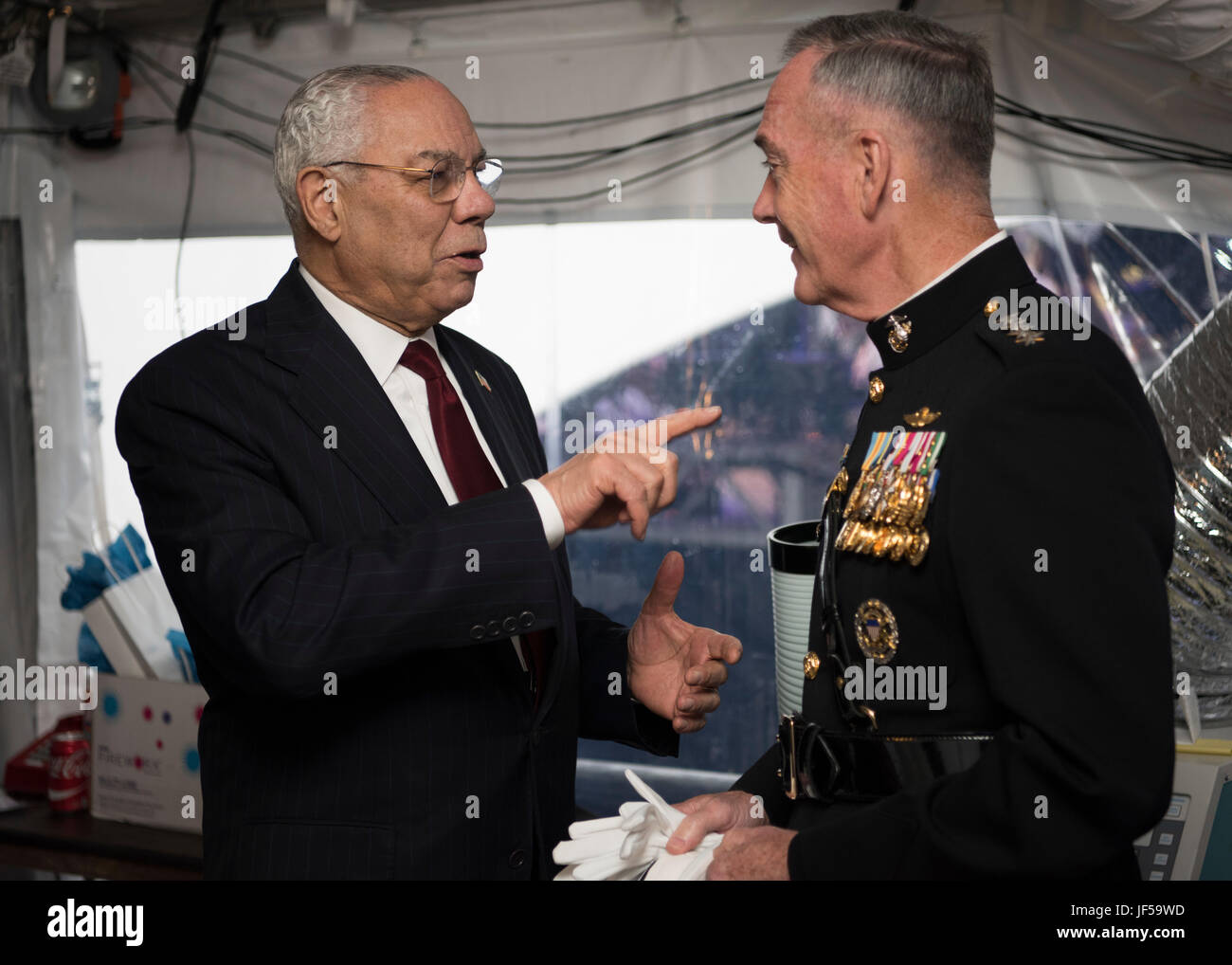 Army Gen.Colin L. Powell, (Ret.) speaks with Marine Corps Gen. Joseph F. Dunford Jr., chairman of the Joint Chiefs of Staff, before the National Memorial Day Concert at the west lawn of the U.S. Capitol, Washington, D.C., May 28, 2017. The concert’s mission is to unite the country in remembrance and appreciation of the fallen and to serve those who are grieving. (Dept. of Defense photo by Navy Petty Officer 2nd Class Dominique A. Pineiro/Released) Stock Photo