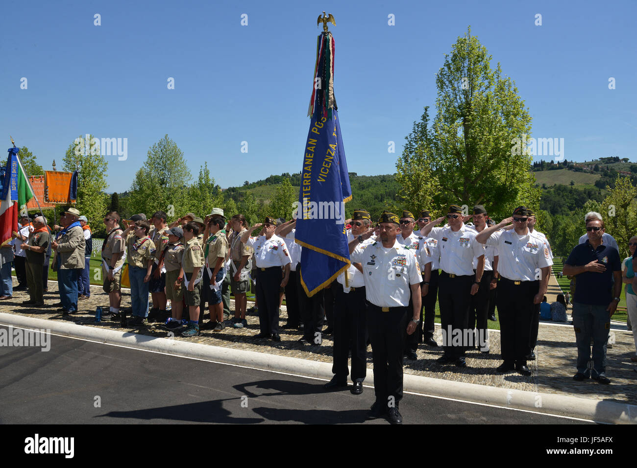 Veterans of Foreign World Wars Post 8862, Vicenza, and The Boy Scouts of America salute during the Memorial Day ceremony at the Florence American Cemetery and Memorial, Florence, Italy, May 29, 2017. (U.S. Army Photo by Visual Information Specialist Paolo Bovo/released) Stock Photo
