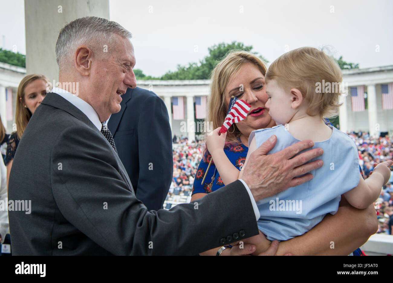 Secretary of Defense Jim Mattis meets with Ashley and David Wheeler before a Memorial Day ceremony at Arlington National Cemetery in Arlington, Va., May 29, 2017. Ashley's husband, U.S. Army Master Sgt. Joshua Wheeler, was killed in action Oct. 22, 2015, while fighting against the Islamic State during Operation Inherent Resolve. (DOD photo by U.S. Air Force Tech. Sgt. Brigitte N. Brantley) Stock Photo