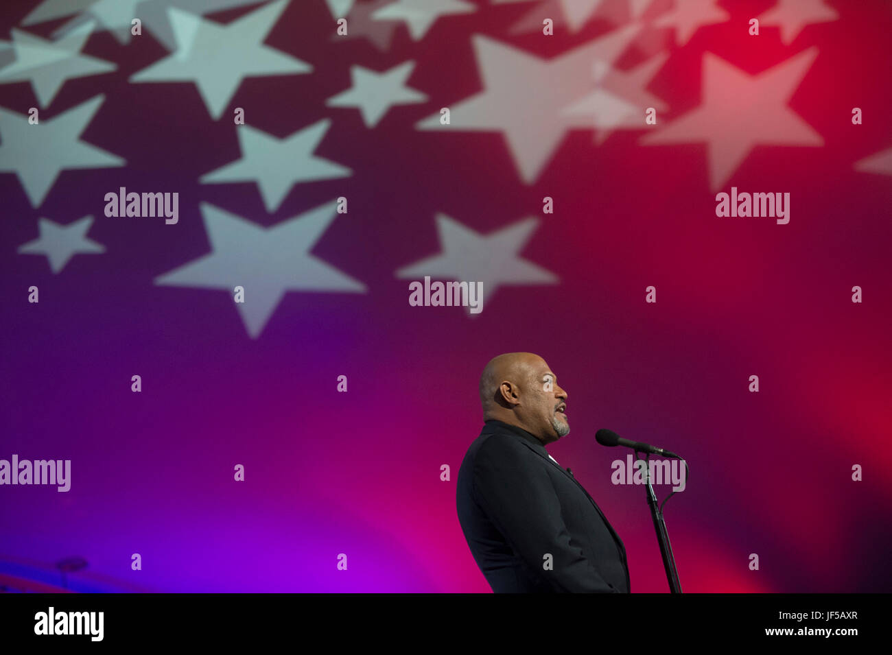 Laurence Fishburne co-hosts the National Memorial Day Concert at the west lawn of the U.S. Capitol, Washington, D.C., May 28, 2017. The concert’s mission is to unite the country in remembrance and appreciation of the fallen and to serve those who are grieving. (Dept. of Defense photo by Navy Petty Officer 2nd Class Dominique A. Pineiro/Released) Stock Photo