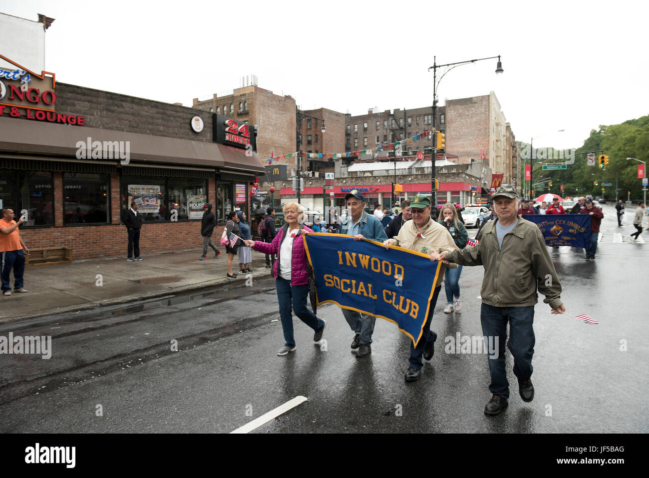 Members with the Inwood Social Club march in the American Legion Inwood Post Memorial Day Parade during Fleet Week New York 2017, May 29, 2017. Marines, Sailors and Coast Guardsmen are in New York to interact with the public, demonstrate capabilities and teach the people of New York about America's sea services. (U.S. Marine Corps photo by Cpl. Erasmo Cortez III) Stock Photo
