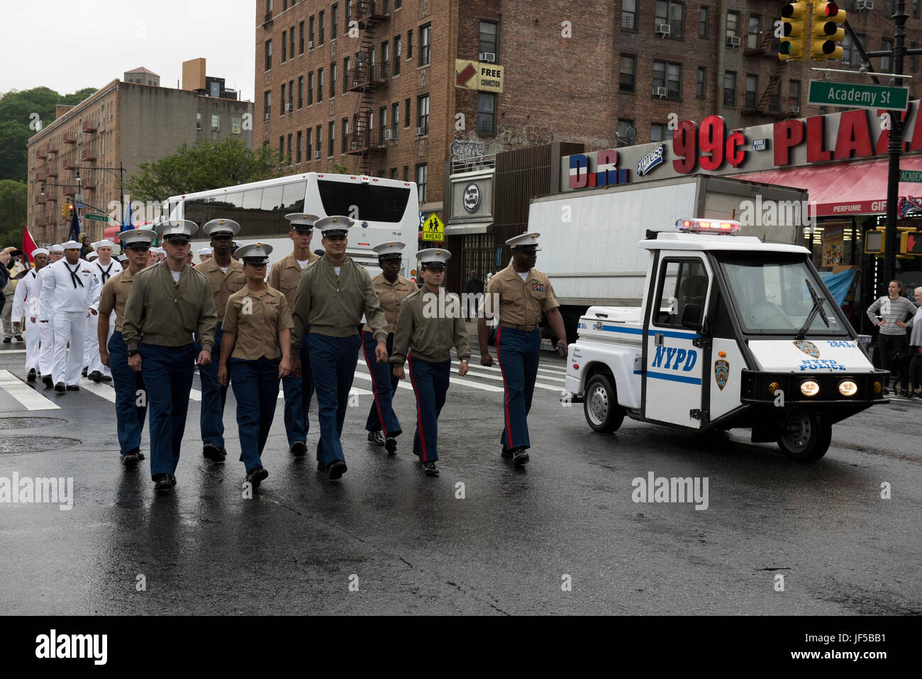 Marines and Sailors march in the American Legion Inwood Post Memorial Day Parade during Fleet Week New York 2017, May 29, 2017. Marines, Sailors and Coast Guardsmen are in New York to interact with the public, demonstrate capabilities and teach the people of New York about America's sea services. (U.S. Marine Corps photo by Cpl. Erasmo Cortez III) Stock Photo