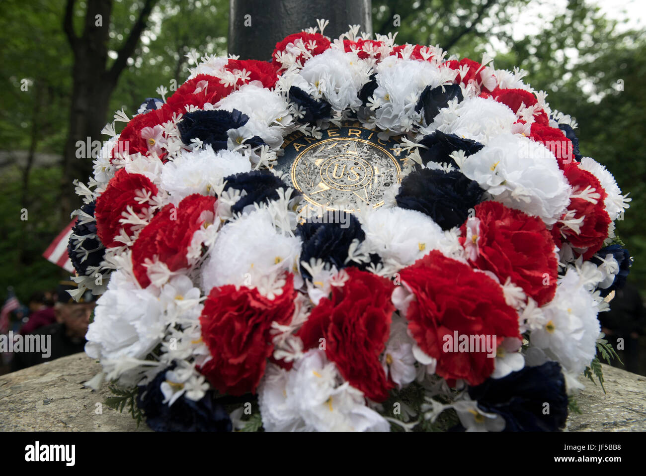 The wreath on display in Inwood Hill Park after the American Legion Inwood Post Memorial Day Parade during Fleet Week New York 2017, May 29, 2017. Marines, Sailors and Coast Guardsmen are in New York to interact with the public, demonstrate capabilities and teach the people of New York about America's sea services. (U.S. Marine Corps photo by Cpl. Erasmo Cortez III) Stock Photo