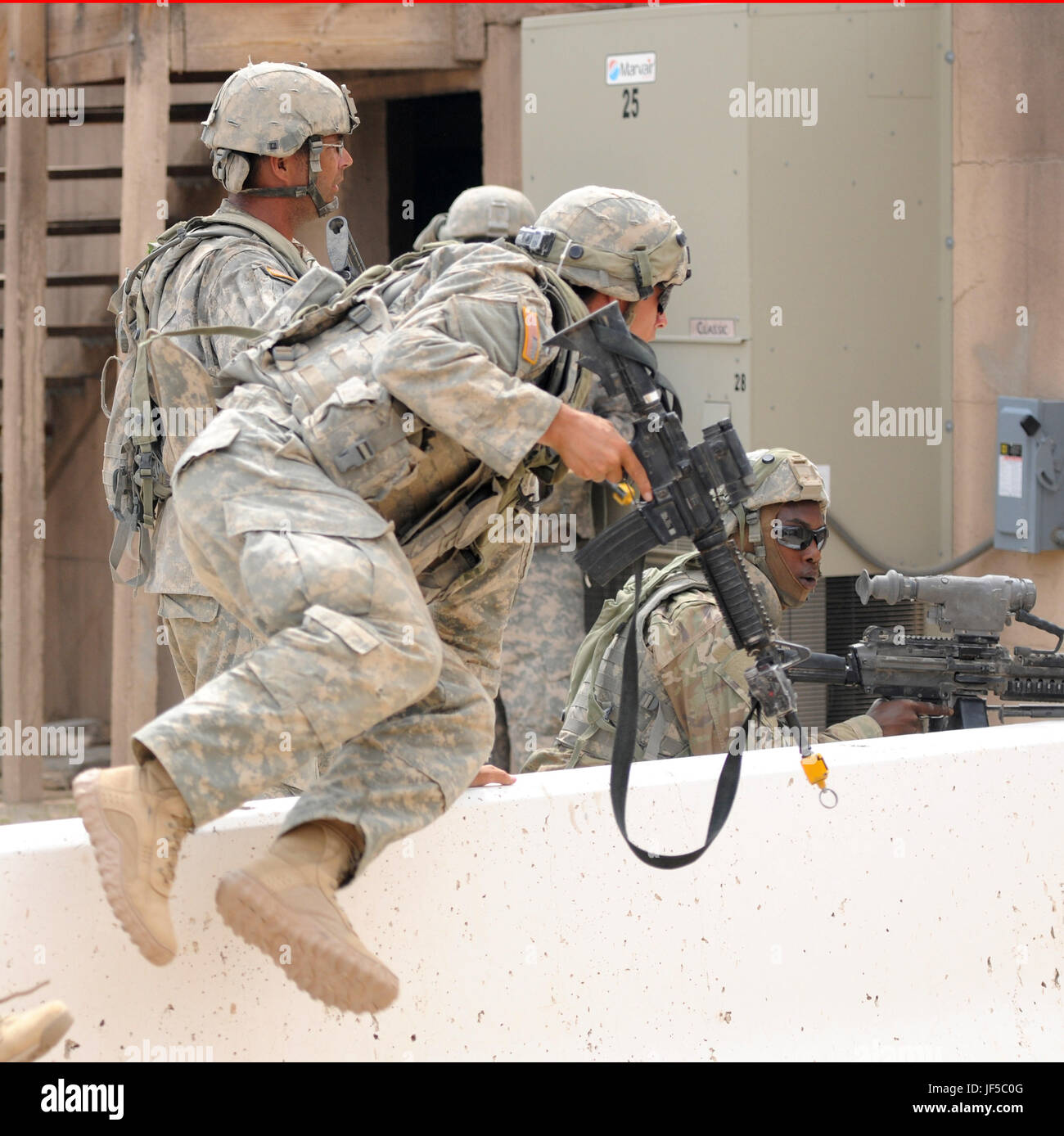 A Soldier of the 155th Armored Brigade Combat Team moves to cover in a