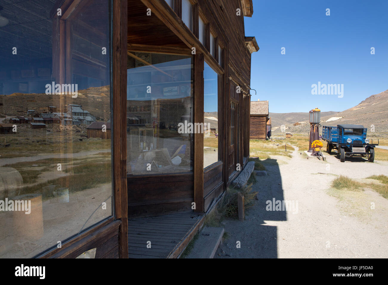 An abandoned general store, gas station, and an antique truck at Bodie Ghost Town. Stock Photo