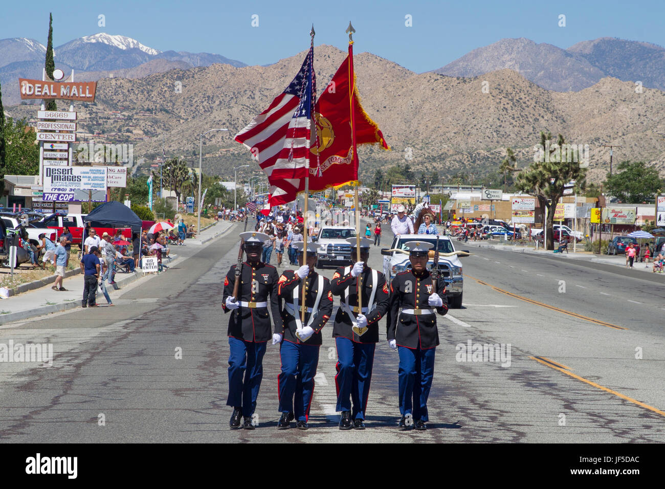 The Combat Center Color Guard leads the parade during the 67th annual