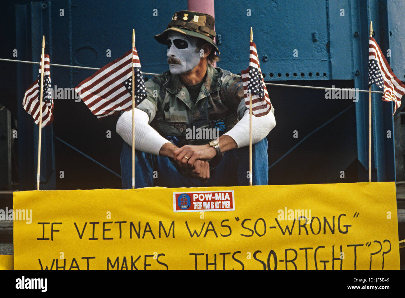 Vietnam Veteran protester at the Gas Works park in downtown Seattle sitting and holding a No War poster protesting the US involvement in Persian Gulf  Stock Photo