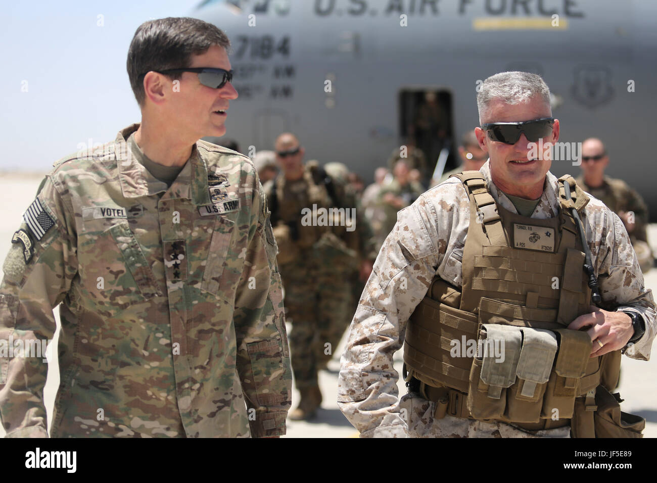 Army Gen. Joseph Votel, left, the commanding general of U.S. Central Command, speaks with Marine Brig. Gen. Roger Turner, right, the commanding general of Task Force Southwest, at Camp Bastion, Afghanistan, June 2, 2017. Votel had an opportunity to speak with the Marines and Sailors of the Task Force, helping gauge the recent progress and current challenges as the unit continues to train, advise and assist the Afghan National Army 215th Corps and 505th Zone National Police. (U.S. Marine Corps photo by Sgt. Lucas Hopkins) Stock Photo