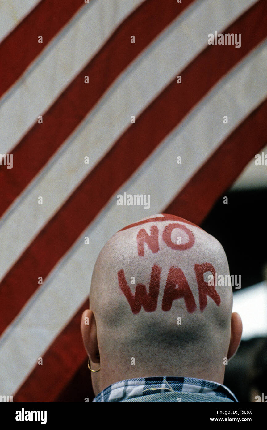 Protester at the Federal Building in downtown Seattle with painted head stating No War protesting the US involvement in Persian Gulf January 15 1991. Stock Photo