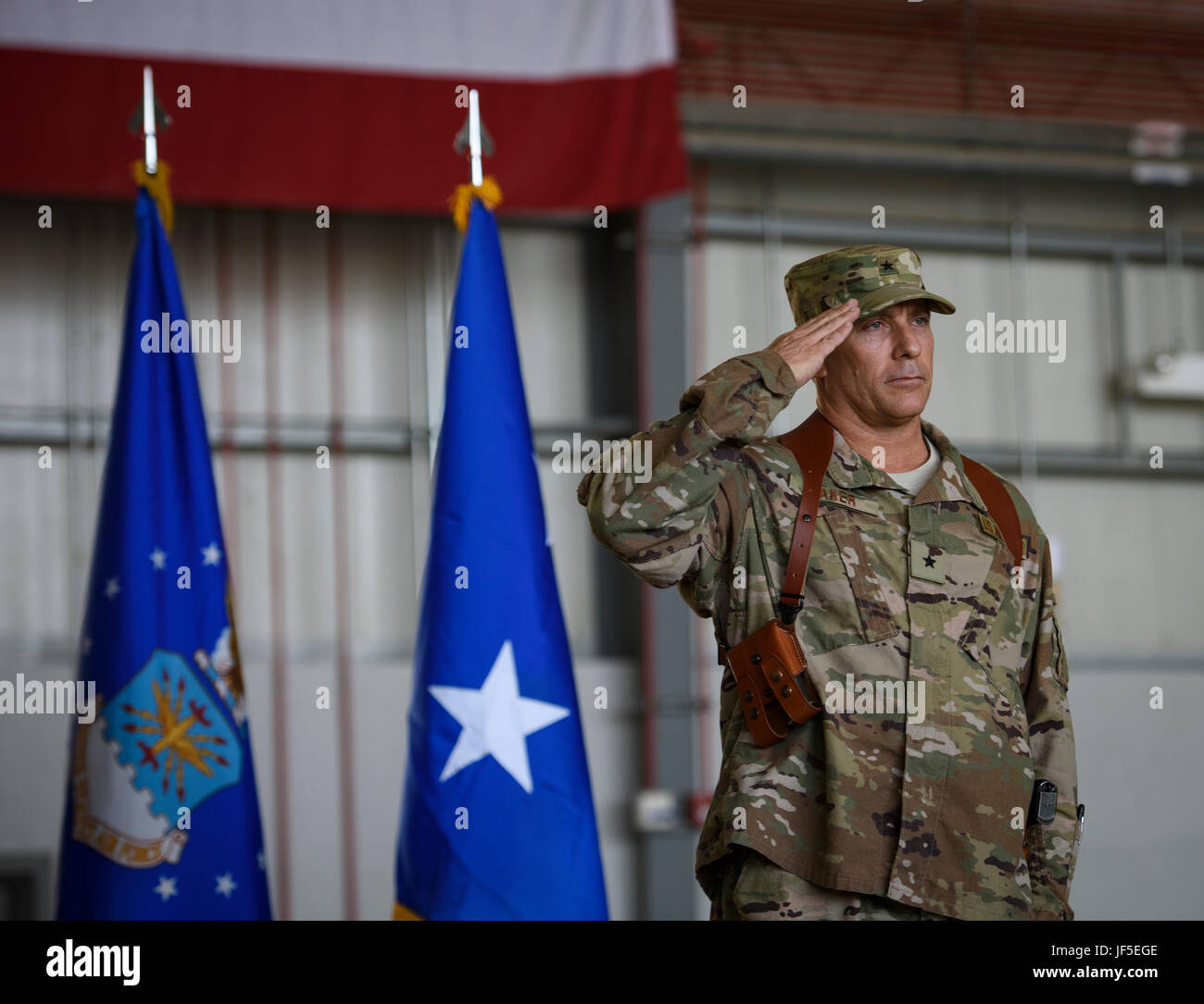 Brig. Gen. Craig Baker, the 455th Air Expeditionary Wing commander, renders his first salute to Airmen of the 455th AEW during a change of command ceremony at Bagram Airfield, Afghanistan, June 3, 2017. Baker previously served as the Director, Deputy Chief of Staff for Operations Checkmate Division at Headquarters U.S. Air Force in Washington D.C. Baker is a command pilot with more than 2,600 hours flying and has flown the F-16 Fighting Falcon and F-22 Raptor. (U.S. Air Force photo by Staff Sgt. Benjamin Gonsier) Stock Photo