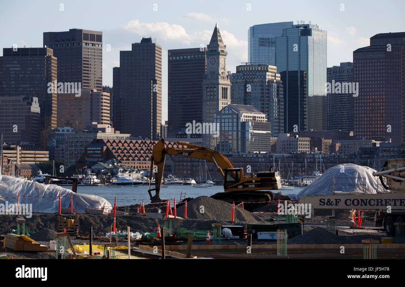 Construction site new condominium development known as Clippership Wharf on the East Boston Water Front,  skyline Boston Harbor Stock Photo