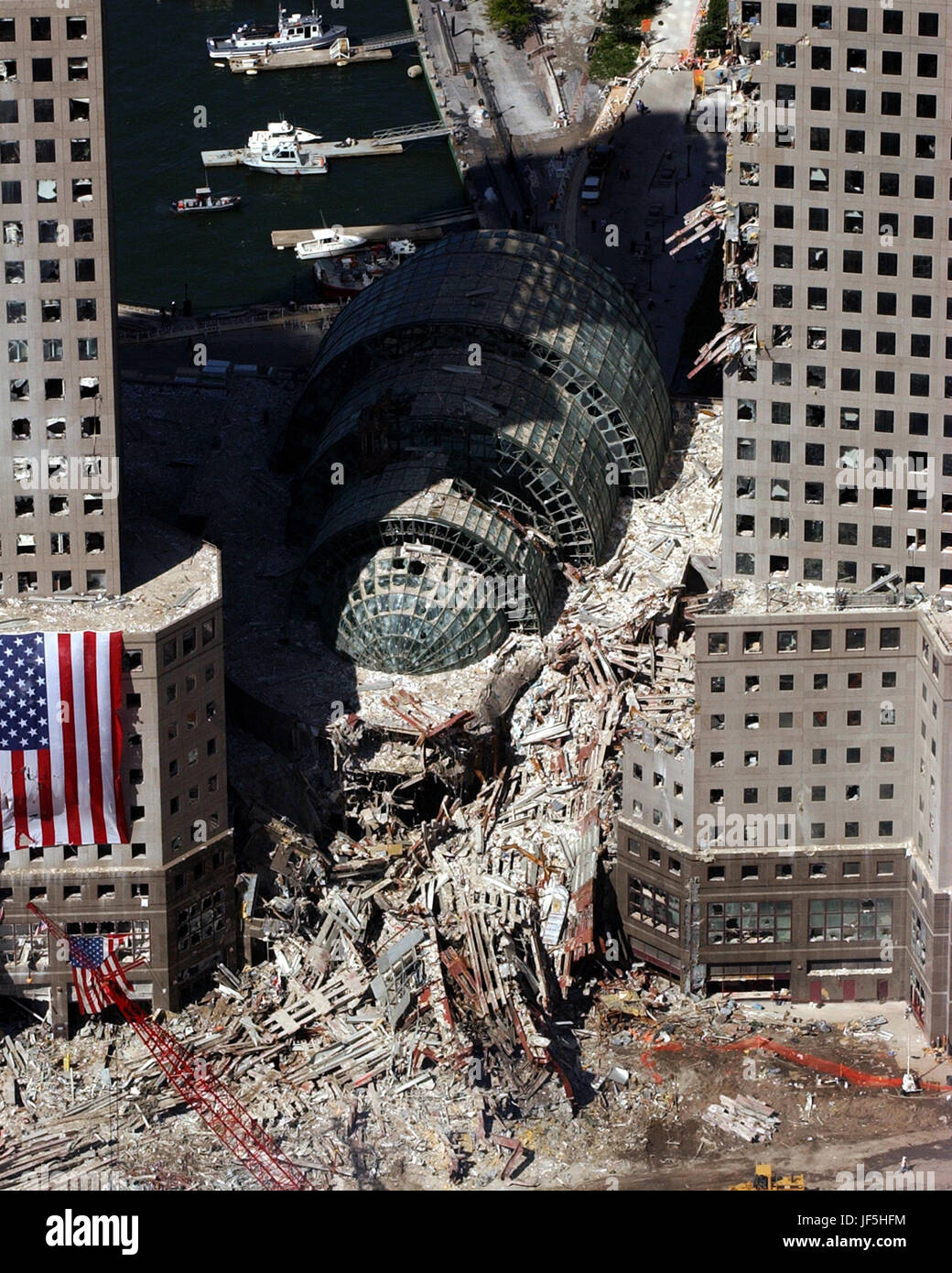 010917-N-7479T-513 Ground Zero, New York City, N.Y. (Sept. 17, 2001) -- An aerial view shows only a small portion of the crime scene where the World Trade Center collapsed following the Sept. 11 terrorist attack.  Surrounding buildings were heavily damaged by the debris and massive force of the falling twin towers.  Clean-up efforts are expected to continue for months.  U.S. Navy photo by Chief Photographer's Mate Eric J. Tilford. Stock Photo