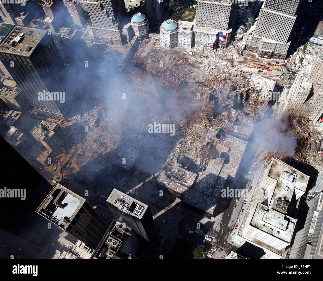 010917-N-7479T-514 Ground Zero, New York City, N.Y. (Sept. 17, 2001) -- An aerial view shows only a small portion of the crime scene where the World Trade Center collapsed following the Sept. 11 terrorist attack.  Surrounding buildings were heavily damaged by the debris and massive force of the falling twin towers.  Clean-up efforts are expected to continue for months.  U.S. Navy photo by Chief Photographer's Mate Eric J. Tilford. Stock Photo