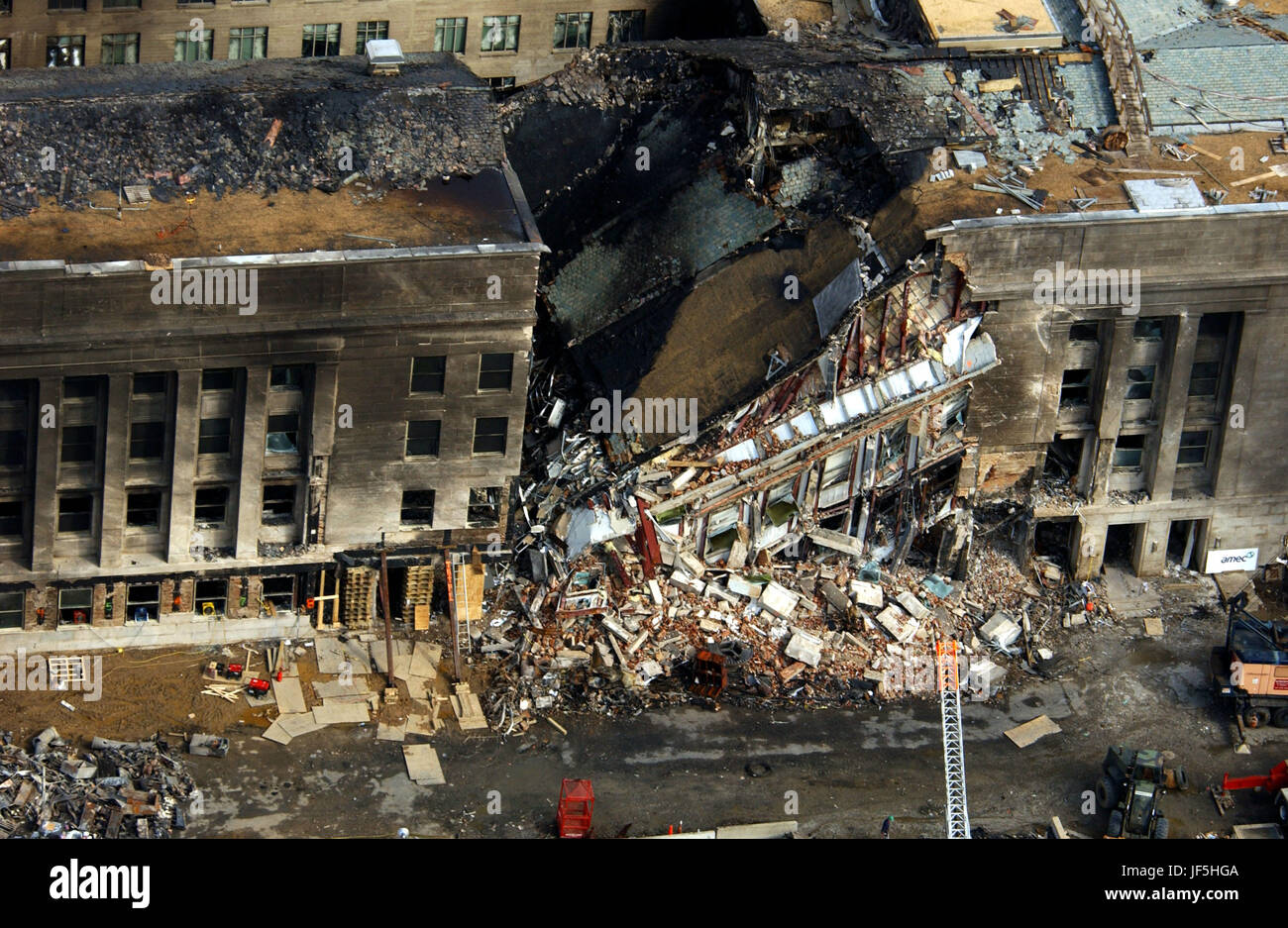 010914-F-8006R-001  This aerial photograph shot on Sept. 14, 2001, shows some of the destruction caused when the high-jacked American Airlines flight slammed into the Pentagon on Sept. 11.  The terrorist attack caused extensive damage to the west face of the building and followed similar attacks on the twin towers of the World Trade Center in New York City.   DoD photograph by Tech. Sgt. Cedric H. Rudisill. Stock Photo