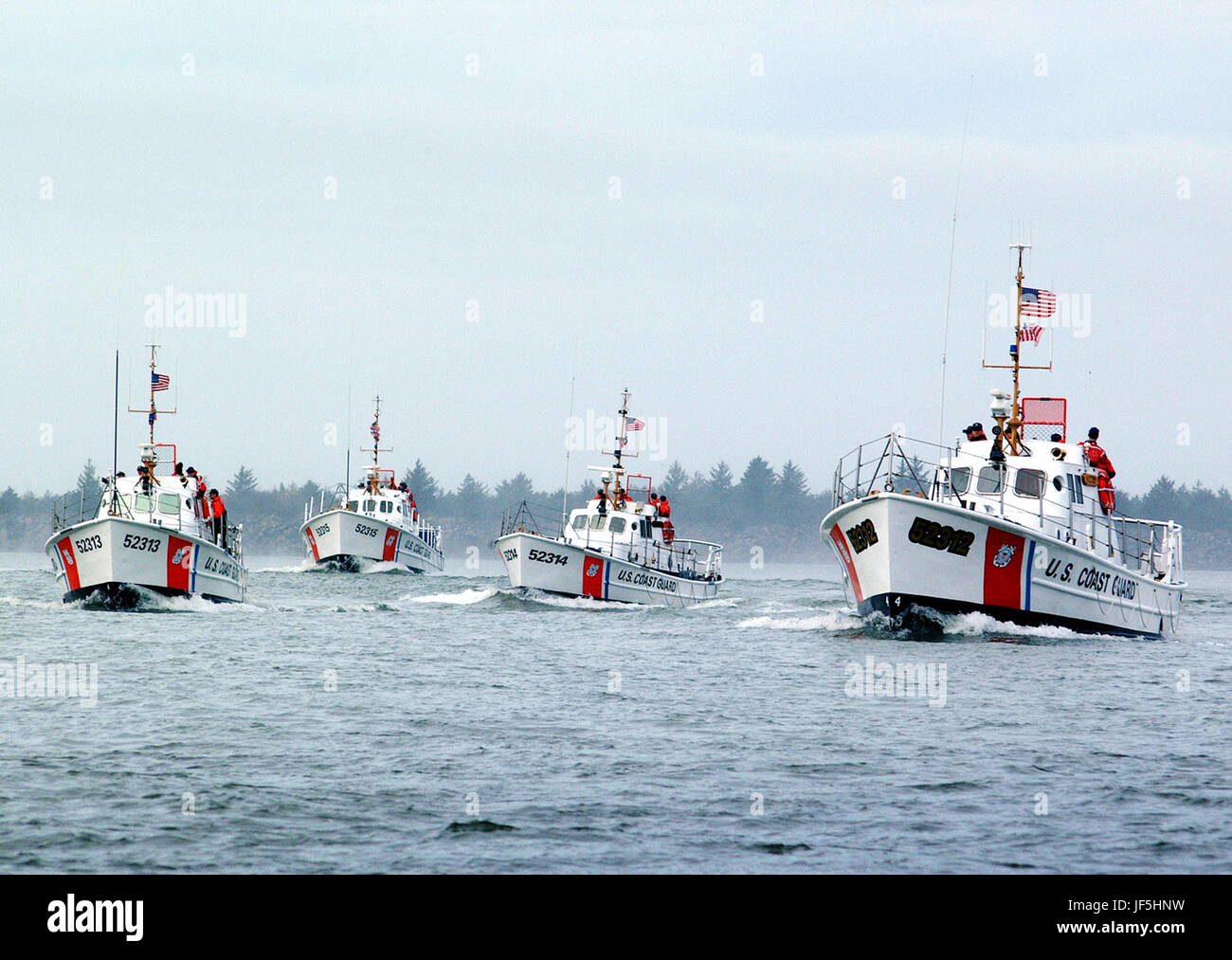 CAPE DISAPPOINTMENT, Wash. (Feb. 13, 2003)--The Coast Guard's four remaining 52-foot motor lifeboats, Invincible II, Intrepid, Triumph II and Victory get underway together for the first time since 1998 at Station Cape Disappointment, WA. Feb. 13, 2003. The 52-foot motor life boats are widely used in support of search and rescue, maritime law enforcement, marine environmental protection and recreational boating safety.   USCG photo by PA3 Kurt Fredrickson Stock Photo