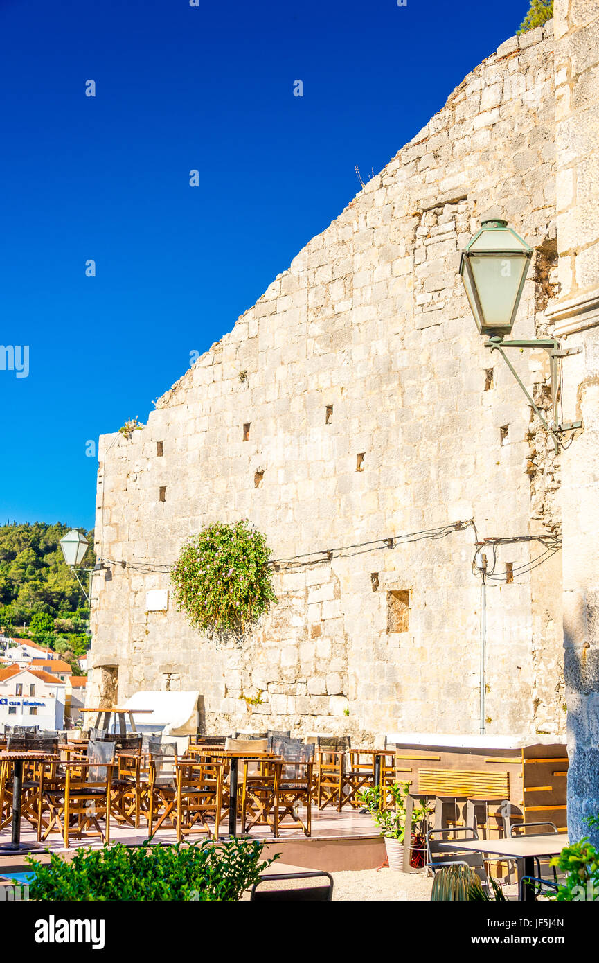 A restaurant along Korcula Old Town’s promenade in Zakerjan. Korcula town (old town) on a sunny summer's day in Croatia Stock Photo