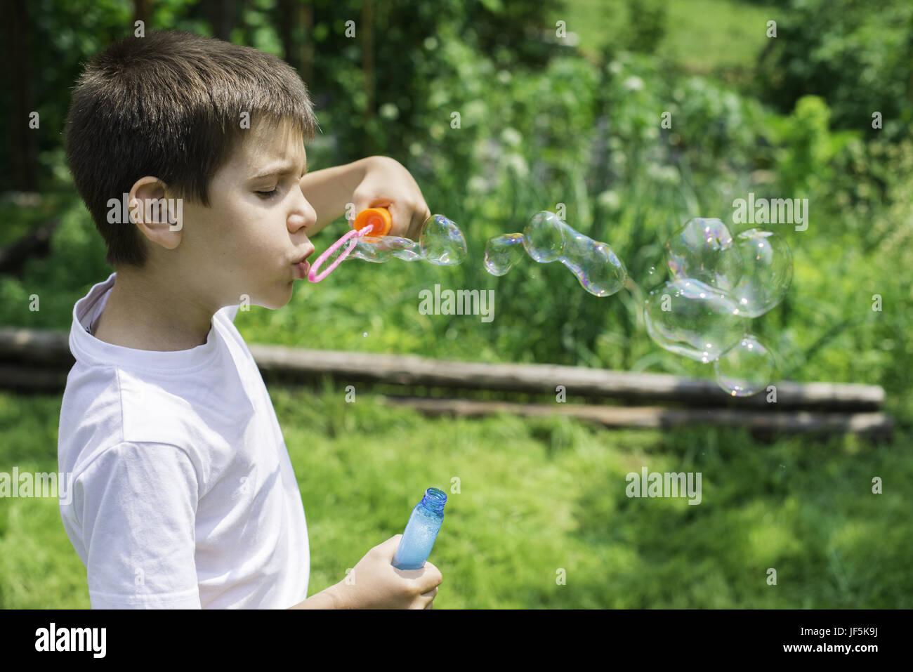 Child makes bubbles Stock Photo Alamy