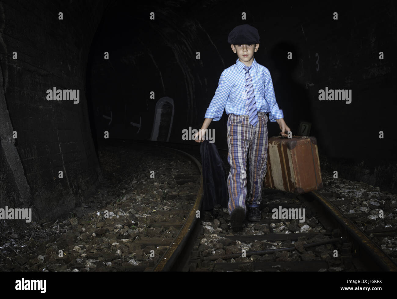 Boy walking on railway line hi-res stock photography and images - Alamy
