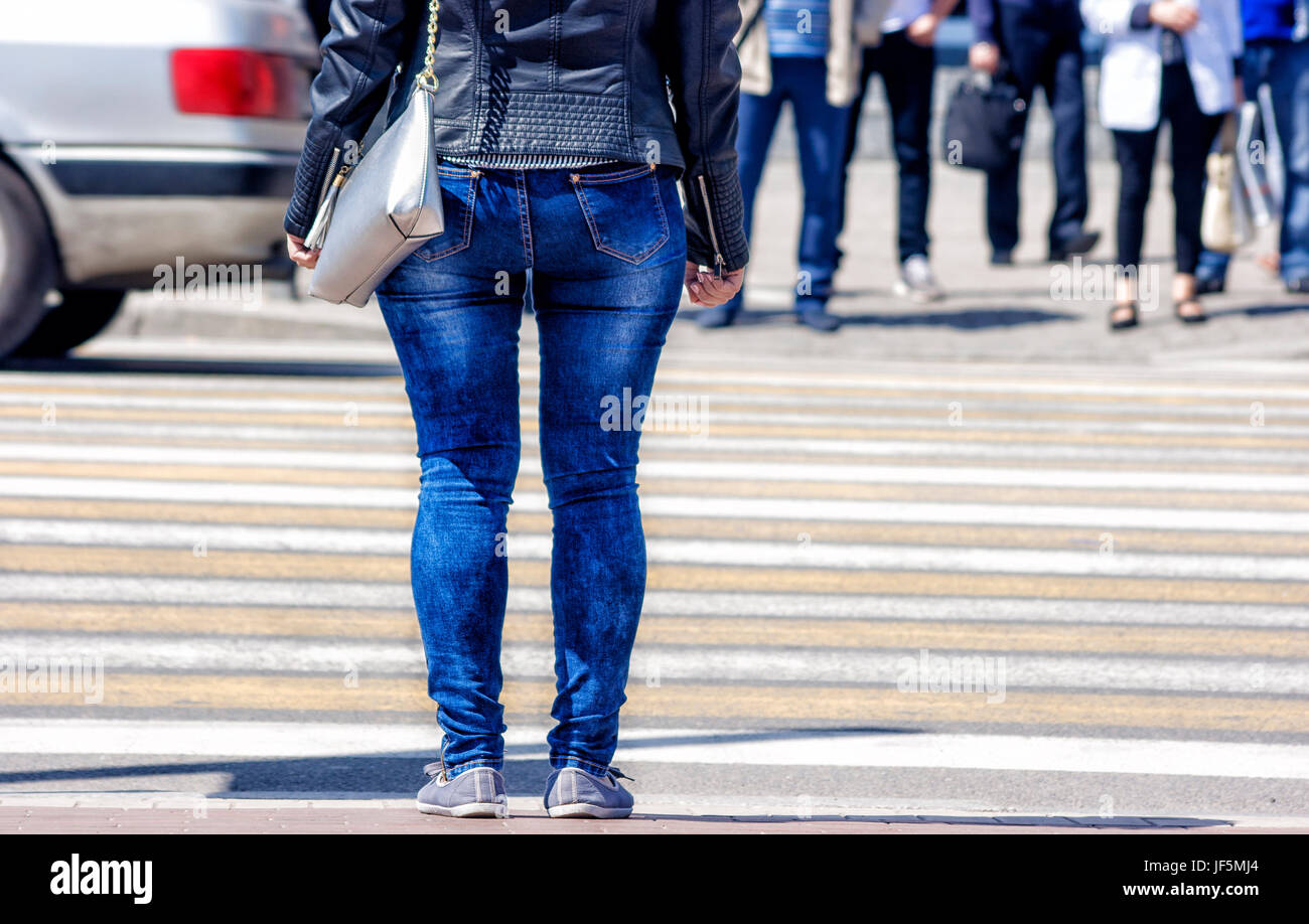 waiting woman at the pedestrian crossing and car traffic Stock Photo ...
