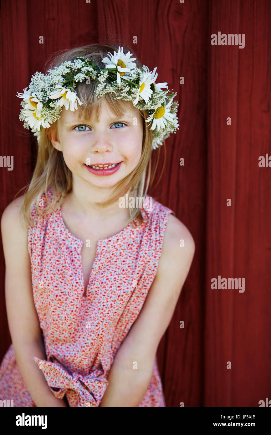 Portrait of girl wearing flower wreath Stock Photo - Alamy