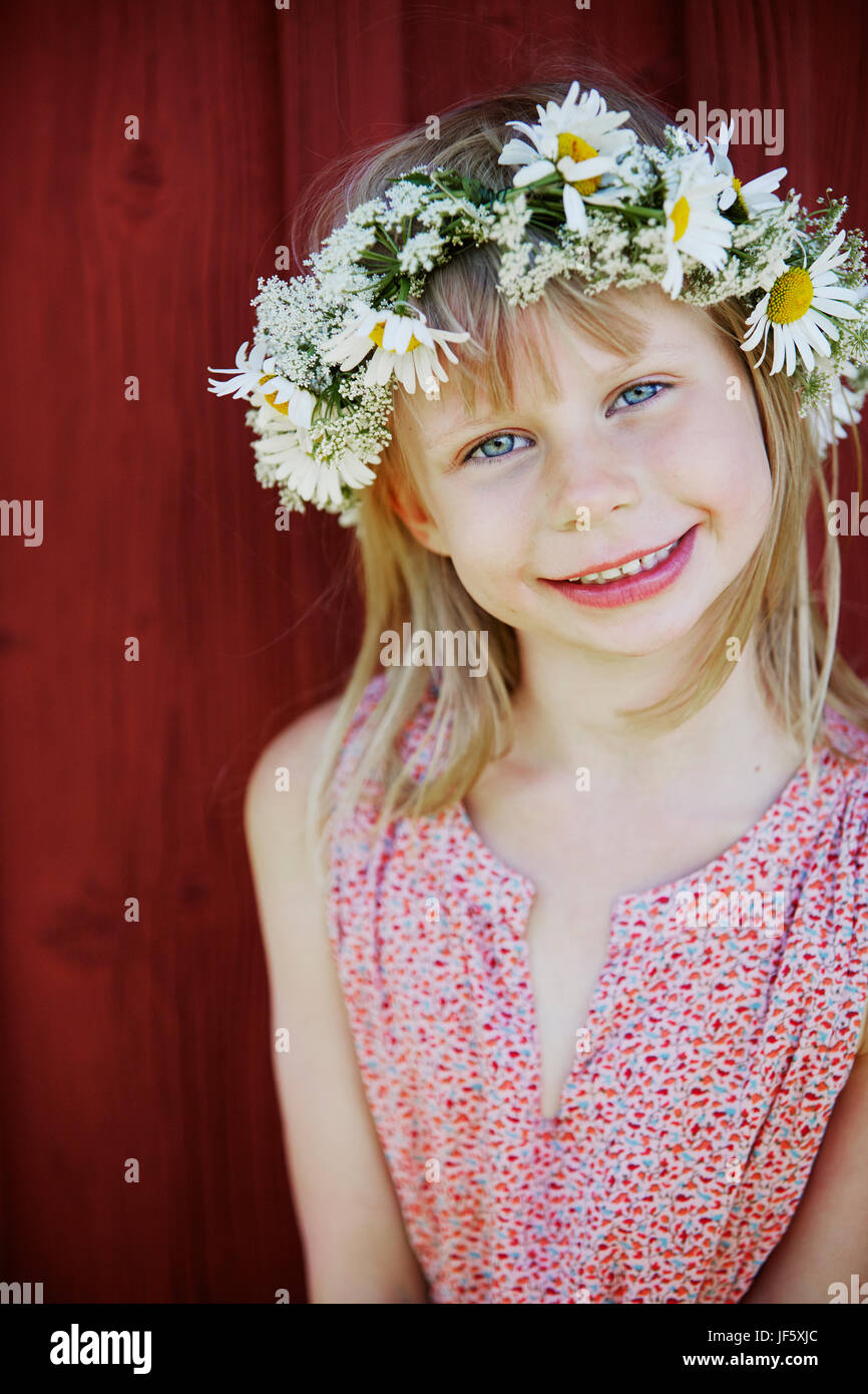 Portrait of girl wearing flower wreath Stock Photo - Alamy